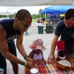 grinding wheat at the farmers market